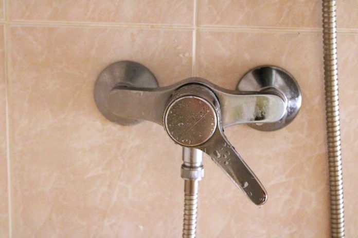 A shower faucet with a hand shower head