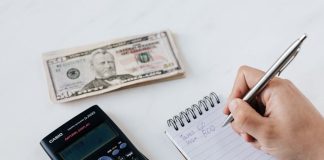 Urgent Personal Loan for Emergency Expenses: What You Need to Know Close-up of budgeting items including calculator, cash, and notebook for financial planning.