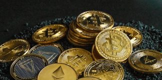 a pile of bitcoins sitting on top of a pile of gravel