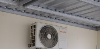 An air conditioning unit mounted on a wall.