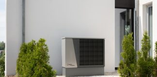 Heat Pump Services That Keep Comfort Flowing Without Interruptions a air conditioner sitting on the side of a building