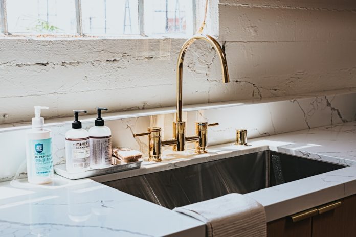 Photo by Andrew Valdivia white ceramic sink with faucet