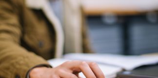 person holding black cordless computer mouse