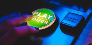 person touching play button