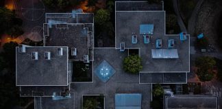 aerial view of green trees and gray concrete building
