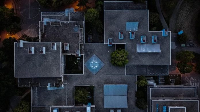 aerial view of green trees and gray concrete building