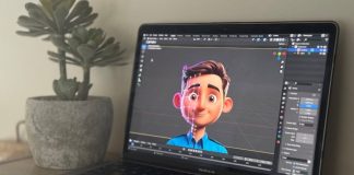 Laptop showing 3D animation in creative workspace with succulent plant.