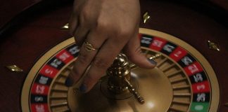 a hand holding a metal object