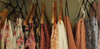 A rack of clothing hanging on a wall