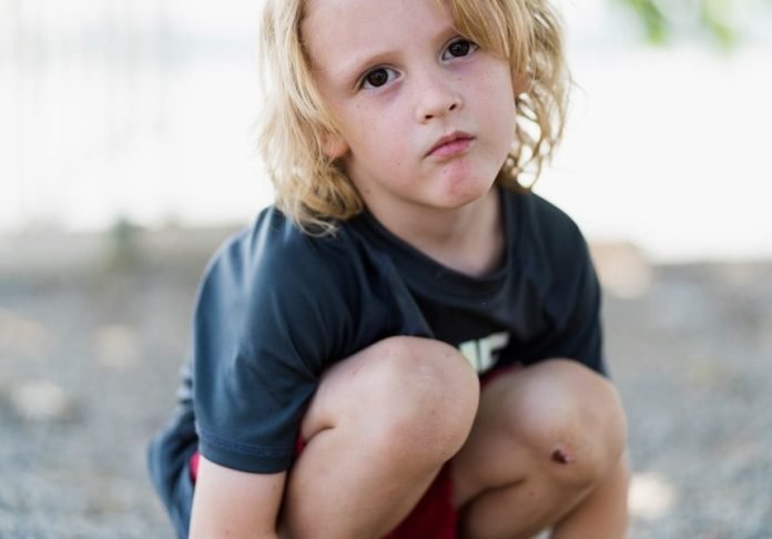 child in black crew-neck t-shirt