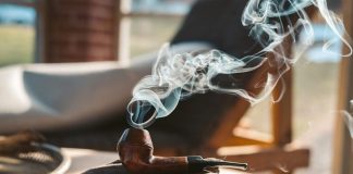 smoke coming from brown smoking pipe