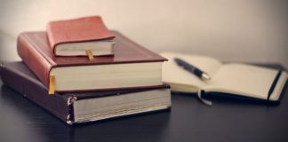 How Long Should You Keep a Litigation Hold Active selective focus photography of three books beside opened notebook