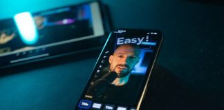 Smartphone displaying a man's face with "easy!" text.