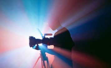 Shape Your Future Through Video black and gray camera tripod