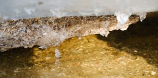 a close up of water and ice on a surface