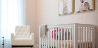 A cozy nursery with a white crib and armchair.