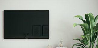 black flat screen tv on white wall