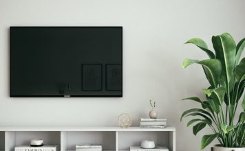 black flat screen tv on white wall