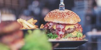 selective focus photo of burger with bacon