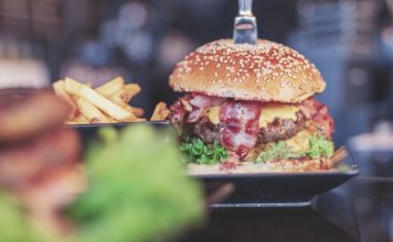 selective focus photo of burger with bacon