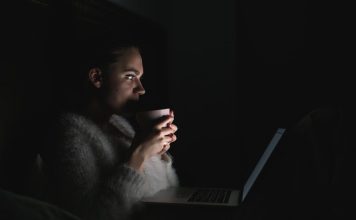 Why We Love Stories That Leave Something Unanswered a person sitting in front of a laptop