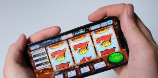 Someone is playing a mobile slot machine game.