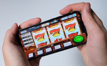 Someone is playing a mobile slot machine game.