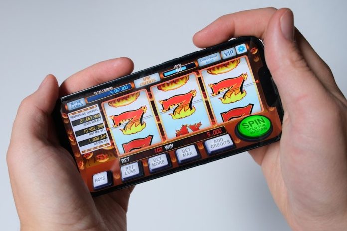 Someone is playing a mobile slot machine game.