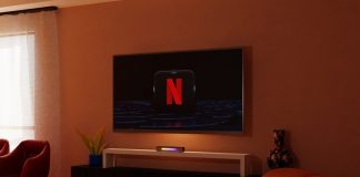 a living room with a flat screen tv on the wall