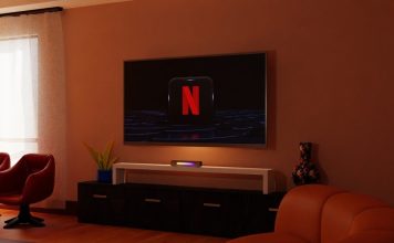 a living room with a flat screen tv on the wall