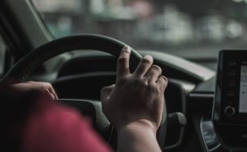 Why Car Accident Lawyers Review Evidence After Serious Collisions a person driving a car with their hand on the steering wheel