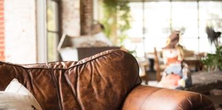 white throw pillow on brown leather armchair