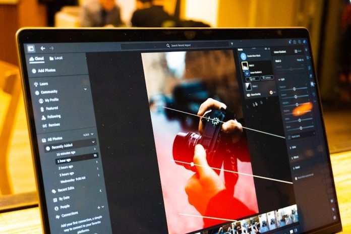Photo by Zulfugar Karimov Photo editing software is shown on a laptop screen