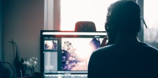 person editing photo on computer