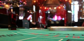 shallow focus photo of green poker table