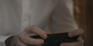 A person is holding and using a smartphone