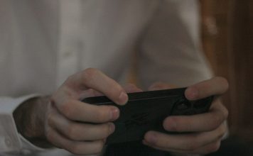 A person is holding and using a smartphone