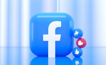 A blue Facebook logo icon with small share, like, and heart reaction spheres