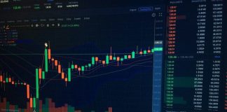 A digital candlestick chart showing cryptocurrency market trends on a dark computer screen