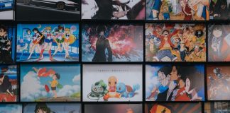 anime character collage photo on black wooden shelf