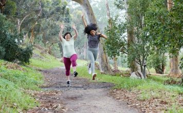 How to Have a Great Weekend Without Alcohol: Five Top Tips two women running down a path in the woods