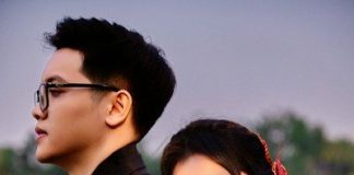 Young couple in kimonos embracing outdoors at dusk