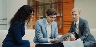 Three business people collaborating on a project