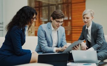 Three business people collaborating on a project