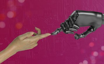 two hands touching each other in front of a pink background