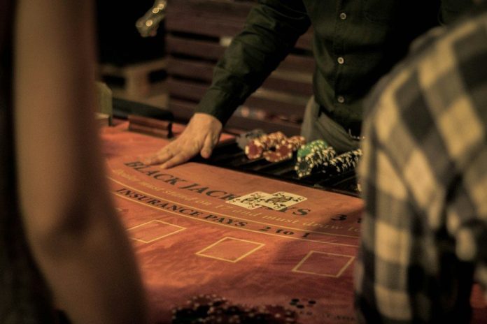 Photo by Dusan Kipic man in green dress shirt sitting on chair